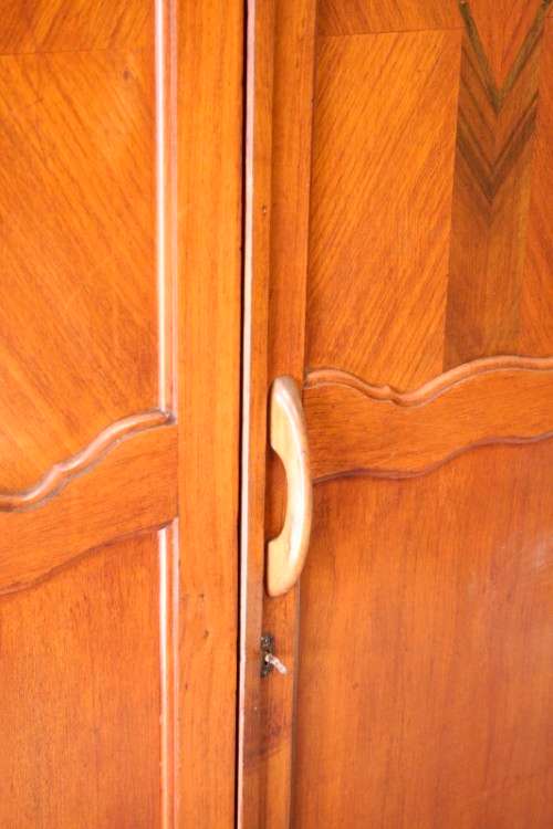 A stunning vintage double-door Oak wardrobe with racks and drawers.