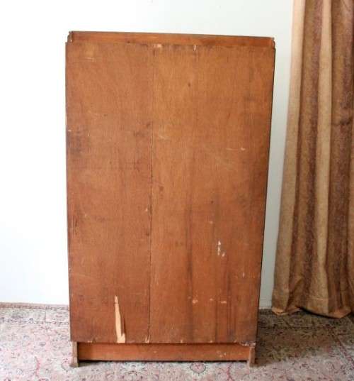 A stunning vintage double-door Oak wardrobe with racks and drawers.