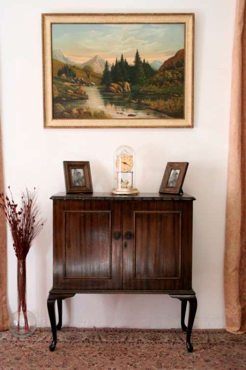A beautiful, elegant vintage two-door Queen Anne TV cabinet, ideal for compact spaces.
