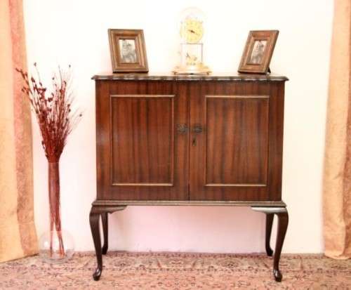 A beautiful, elegant vintage two-door Queen Anne TV cabinet, ideal for compact spaces.