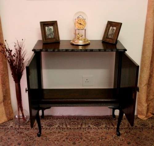 A beautiful, elegant vintage two-door Queen Anne TV cabinet, ideal for compact spaces.