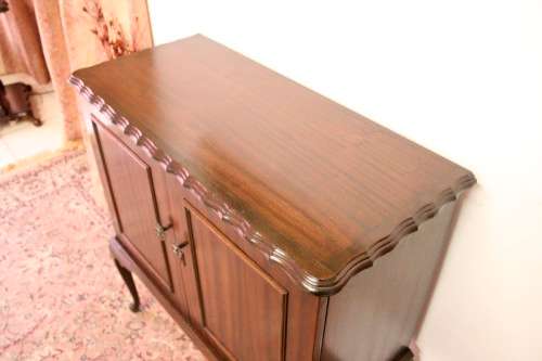 A beautiful, elegant vintage two-door Queen Anne TV cabinet, ideal for compact spaces.