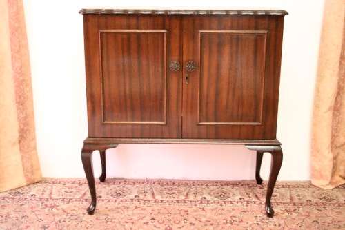 A beautiful, elegant vintage two-door Queen Anne TV cabinet, ideal for compact spaces.
