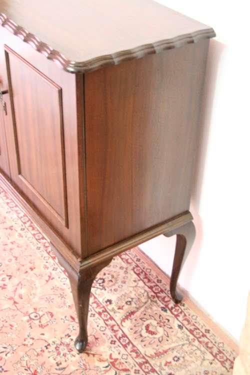 A beautiful, elegant vintage two-door Queen Anne TV cabinet, ideal for compact spaces.