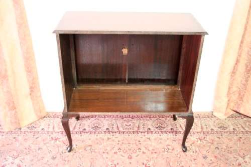A beautiful, elegant vintage two-door Queen Anne TV cabinet, ideal for compact spaces.
