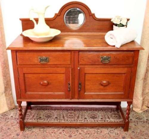 A stunning antique oak side server cabinet with a bevelled mirror, loads of drawer & cupboard space