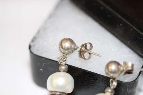 A beautiful pair of Vintage styled genuine cultured baroque pearl and ornate silver beaded earrings