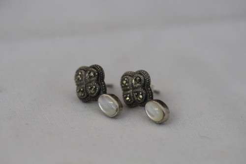 A pretty pair of Art Deco styled ladies fashion earrings with marcasite stones and a opal bead stone