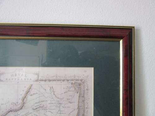 Detailed maps of Africa and Natal framed behind glass in great condition.