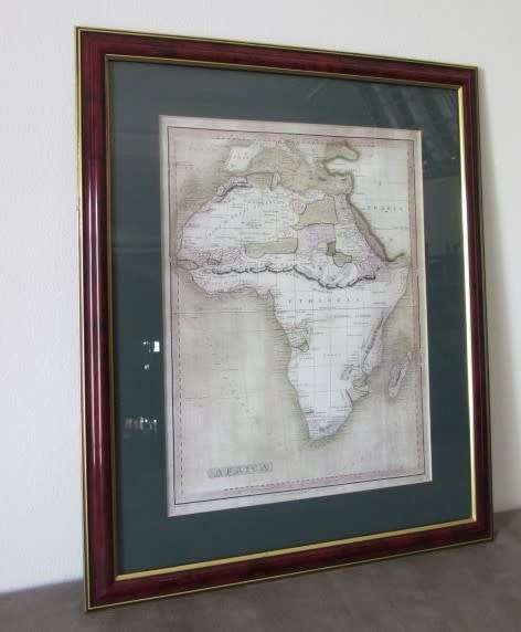 Detailed maps of Africa and Natal framed behind glass in great condition.