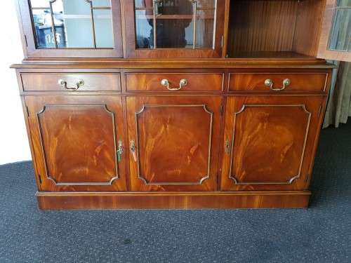 An exquisitely made "Rosjohn" three-glass door show cabinet with drawers and cupboard space