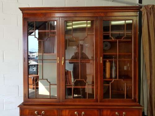 An exquisitely made "Rosjohn" three-glass door show cabinet with drawers and cupboard space