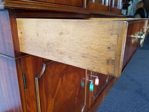 An exquisitely made "Rosjohn" three-glass door show cabinet with drawers and cupboard space