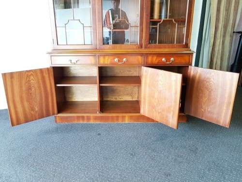 An exquisitely made "Rosjohn" three-glass door show cabinet with drawers and cupboard space
