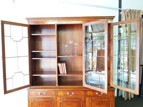 An exquisitely made "Rosjohn" three-glass door show cabinet with drawers and cupboard space