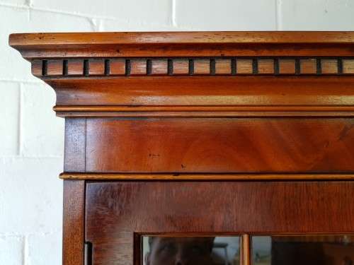 An exquisitely made "Rosjohn" three-glass door show cabinet with drawers and cupboard space