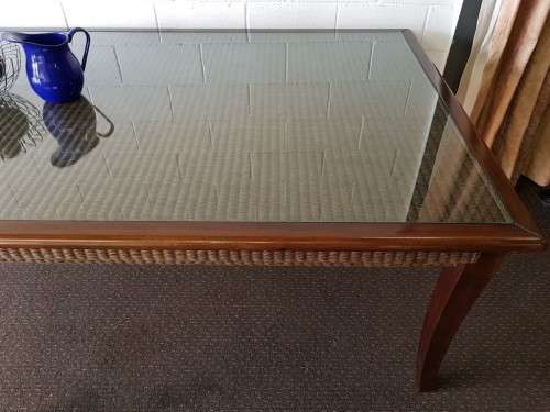 PRICE DRASTICALLY REDUCED!!! A 10-12 seater Mahogany & wicker table with a glass top!