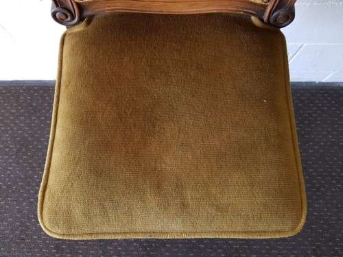 An amazing and unusual antique Mahogany bar chair with long legs and a mustard colour upholstery!!