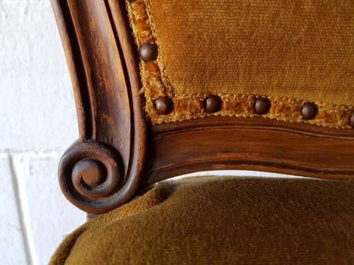 An amazing and unusual antique Mahogany bar chair with long legs and a mustard colour upholstery!!