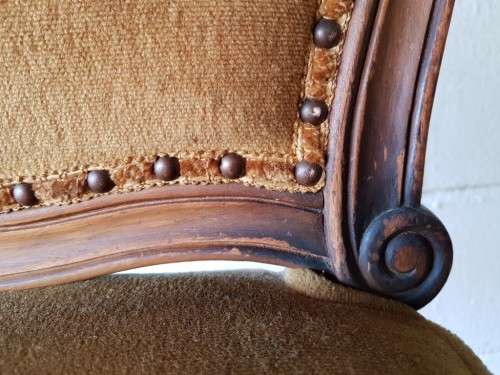 An amazing and unusual antique Mahogany bar chair with long legs and a mustard colour upholstery!!