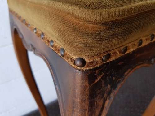 An amazing and unusual antique Mahogany bar chair with long legs and a mustard colour upholstery!!