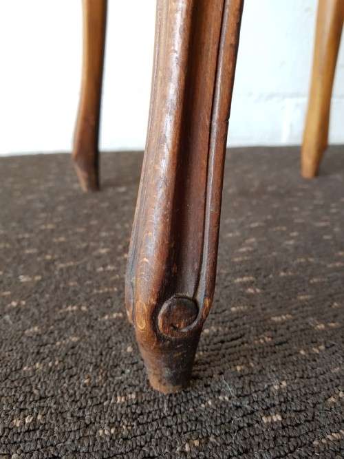 An amazing and unusual antique Mahogany bar chair with long legs and a mustard colour upholstery!!