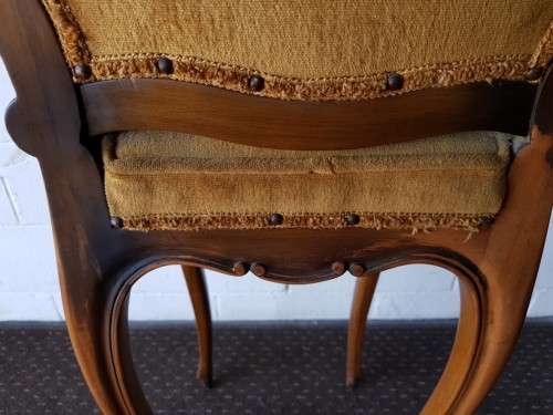 An amazing and unusual antique Mahogany bar chair with long legs and a mustard colour upholstery!!