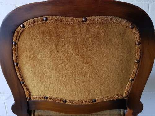 An amazing and unusual antique Mahogany bar chair with long legs and a mustard colour upholstery!!