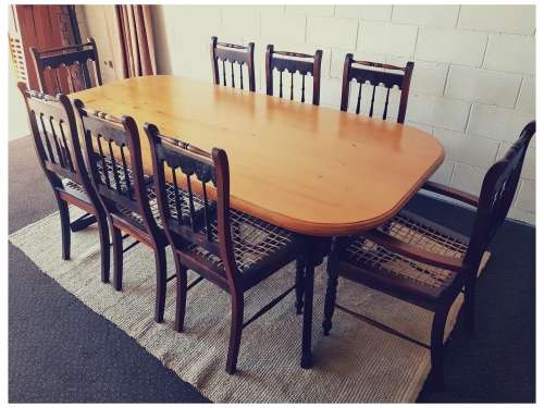 An amazing 8-seater Yellowwood and Imbuia dining suite with 8x stunning riempie dining chairs
