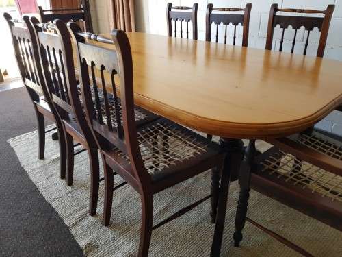 An amazing 8-seater Yellowwood and Imbuia dining suite with 8x stunning riempie dining chairs