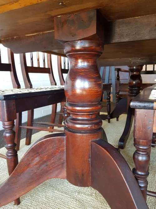 An amazing 8-seater Yellowwood and Imbuia dining suite with 8x stunning riempie dining chairs