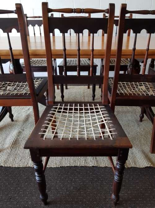 An amazing 8-seater Yellowwood and Imbuia dining suite with 8x stunning riempie dining chairs