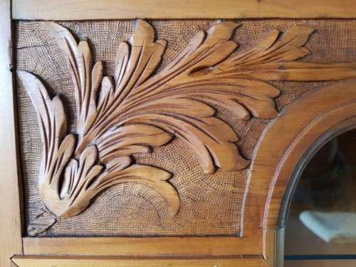 A magnificent vintage solid Oregon display cabinet with glass doors and shelves and hand carvings!!