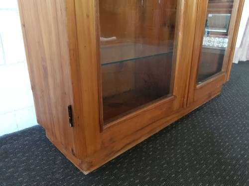 A magnificent vintage solid Oregon display cabinet with glass doors and shelves and hand carvings!!