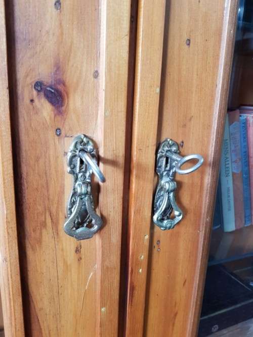 A magnificent vintage solid Oregon display cabinet with glass doors and shelves and hand carvings!!