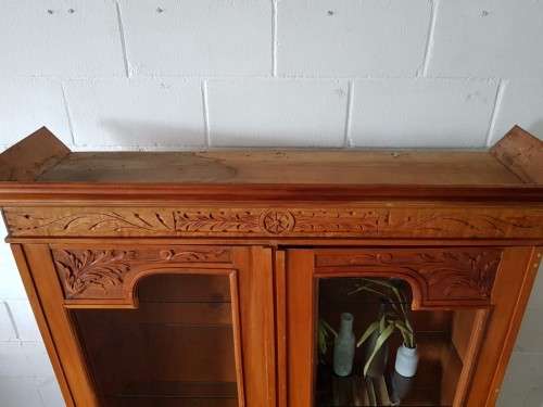 A magnificent vintage solid Oregon display cabinet with glass doors and shelves and hand carvings!!
