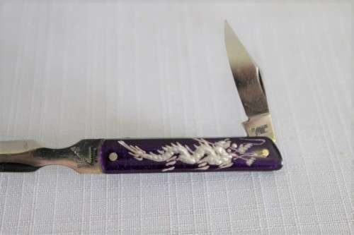 An awesome vintage "Viceroy" stainless steel letter opener with a stunning dragon handle in its box
