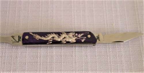 An awesome vintage "Viceroy" stainless steel letter opener with a stunning dragon handle in its box