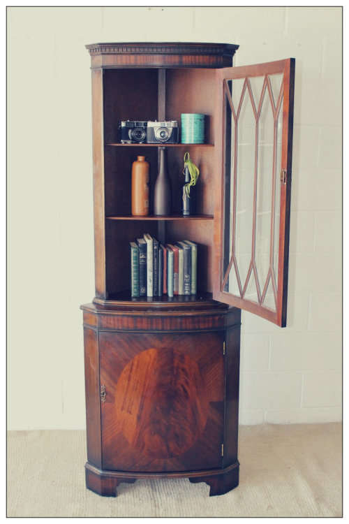 A fantastic Edwardian antique corner display cabinet with a glass door and spacious bottom cupboard