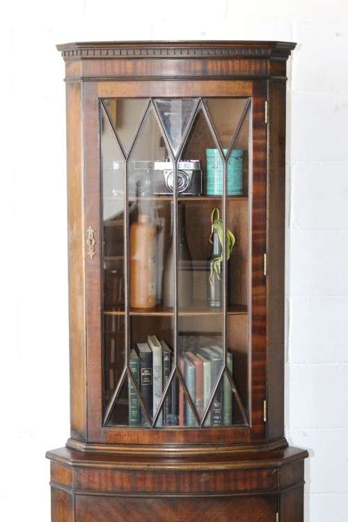 A fantastic Edwardian antique corner display cabinet with a glass door and spacious bottom cupboard