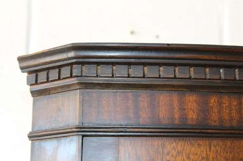 A fantastic Edwardian antique corner display cabinet with a glass door and spacious bottom cupboard