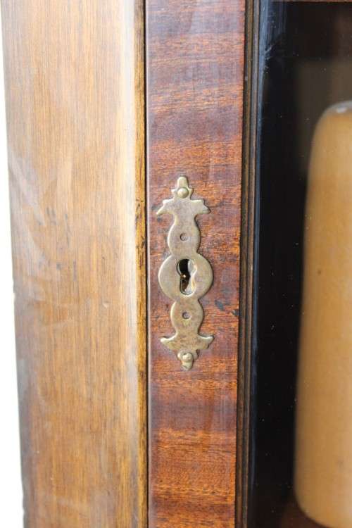 A fantastic Edwardian antique corner display cabinet with a glass door and spacious bottom cupboard
