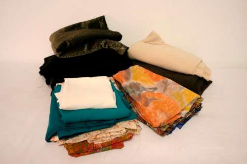 A lovely job lot of different colours and sizes of dress materials in good condition. RS17Sale