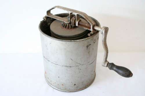 A fantastic vintage metal churn, awesome as a display piece.