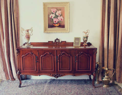 An exquisite vintage side server cabinet with carved detailing and loads of drawer & cupboard space