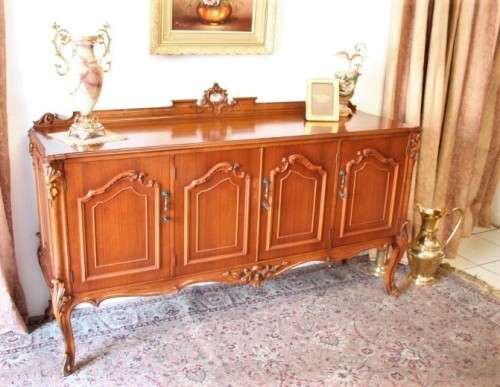 An exquisite vintage side server cabinet with carved detailing and loads of drawer & cupboard space