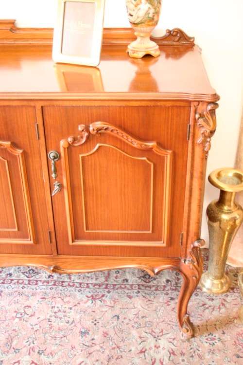 An exquisite vintage side server cabinet with carved detailing and loads of drawer & cupboard space