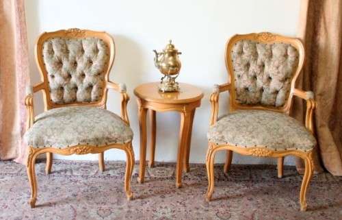 Two magnificent Victorian Oak hand carved chairs with deep button detailing!