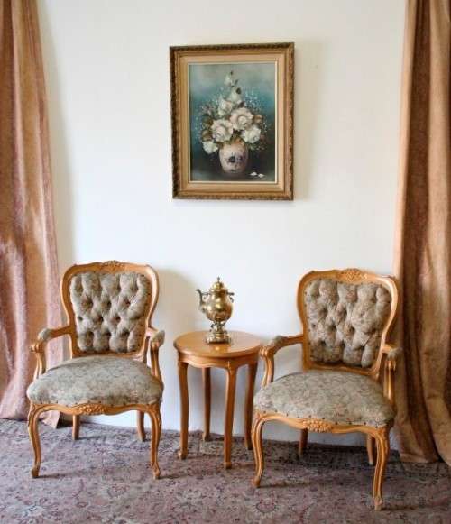 Two magnificent Victorian Oak hand carved chairs with deep button detailing!