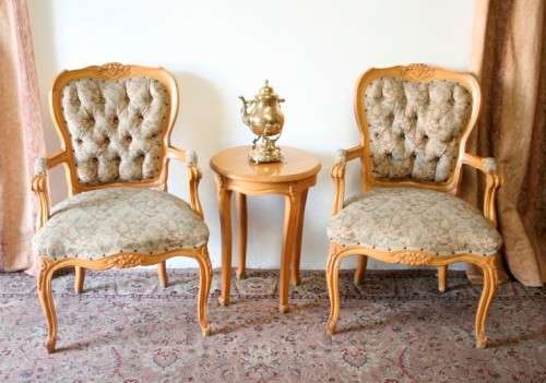 Two magnificent Victorian Oak hand carved chairs with deep button detailing!